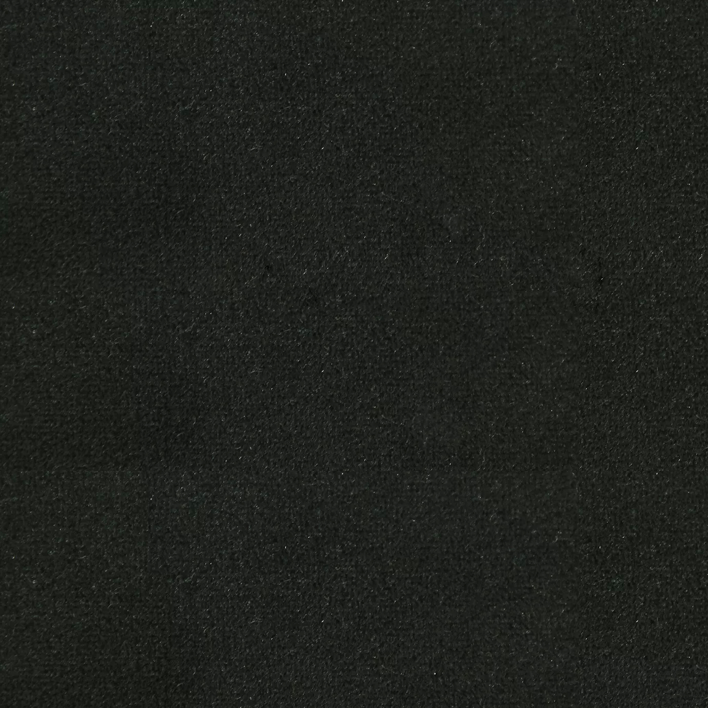 Soft and elegant close-up of a Lux Velvet Black Forest 0785 fabric swatch in a deep and dark green tone, showcasing its velvety texture and a delicate sheen that gives it a feeling of comfort and intense, natural elegance.