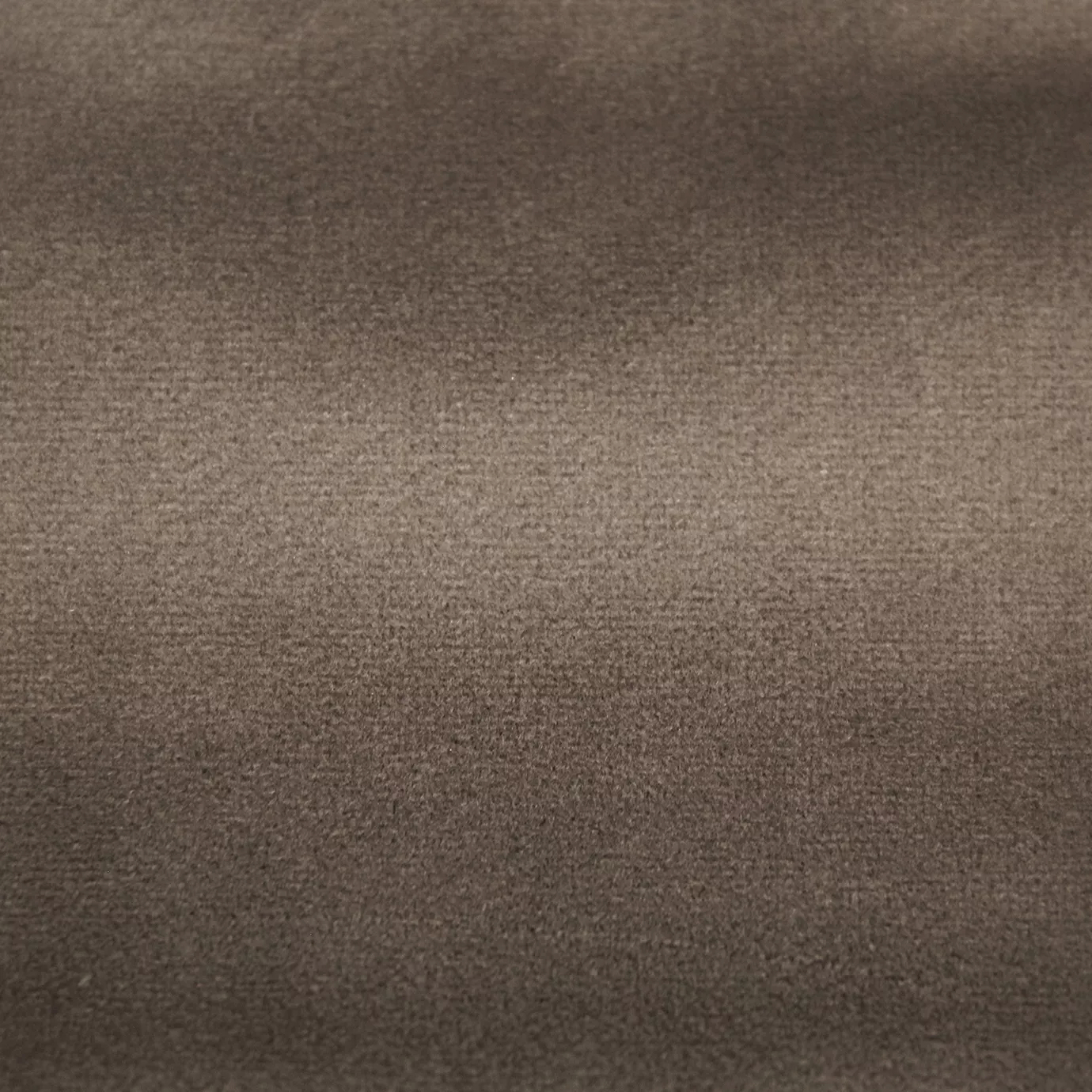 Soft and elegant close-up of a Lux Velvet Camel 0056 fabric swatch in a soft and welcoming camel tone, showcasing its velvety texture and a delicate sheen that gives it a feeling of comfort and natural elegance.