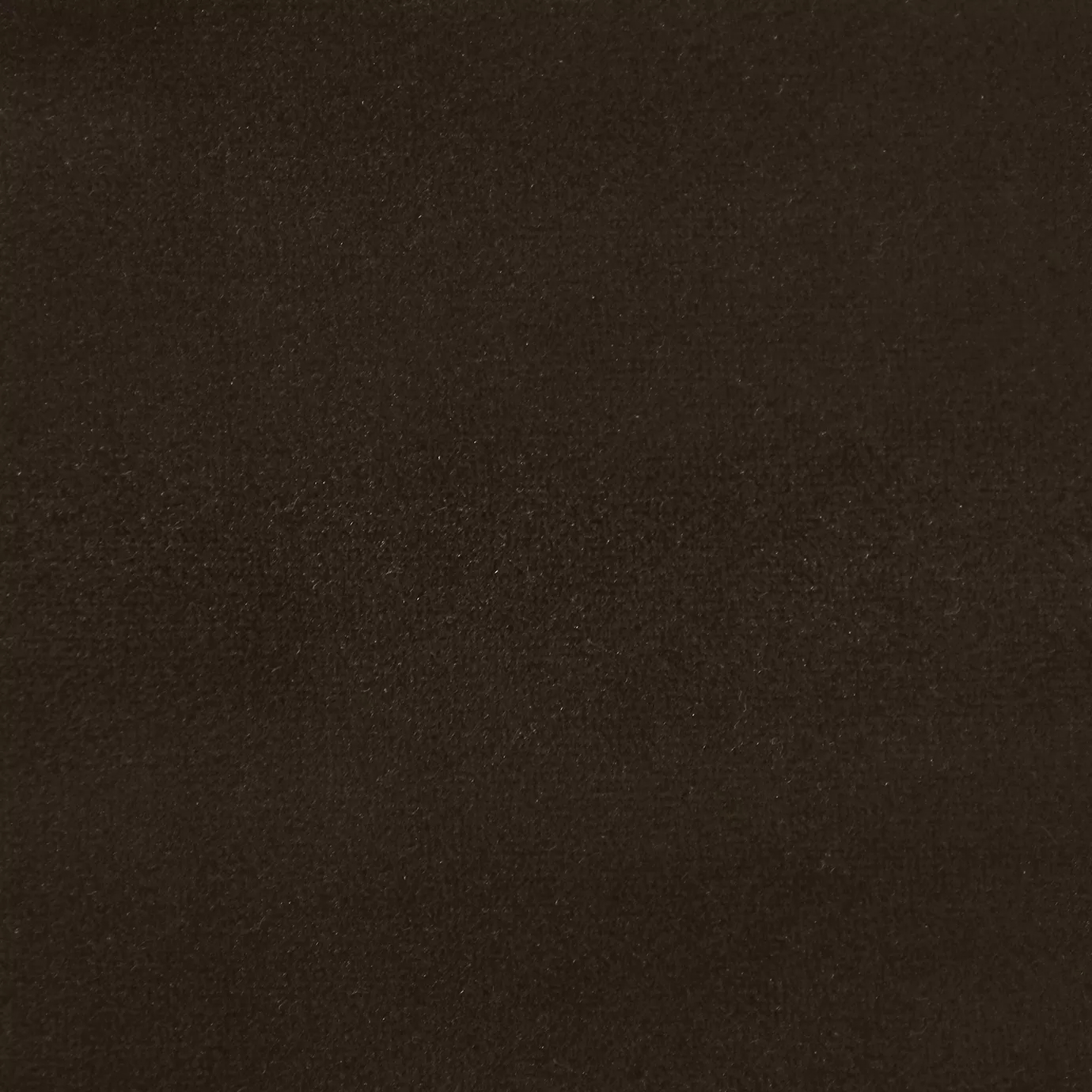 Soft and elegant close-up of a Lux Velvet Chocolat 0450 fabric swatch in a rich and welcoming chocolate tone, showcasing its velvety texture and a delicate sheen that gives it a feeling of comfort and natural elegance.