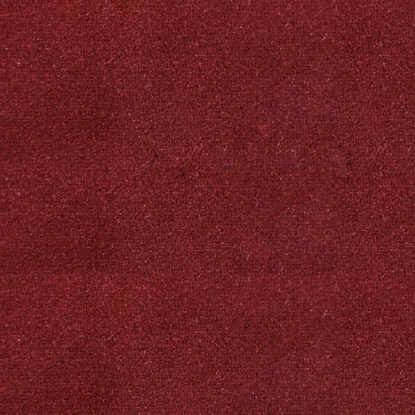 Soft and elegant close-up of a Lux Velvet Coca-Cola Red 0357 fabric swatch in a vibrant and iconic Coca-Cola red tone, showcasing its velvety texture and a delicate sheen that gives it a feeling of comfort and classic vibrancy.