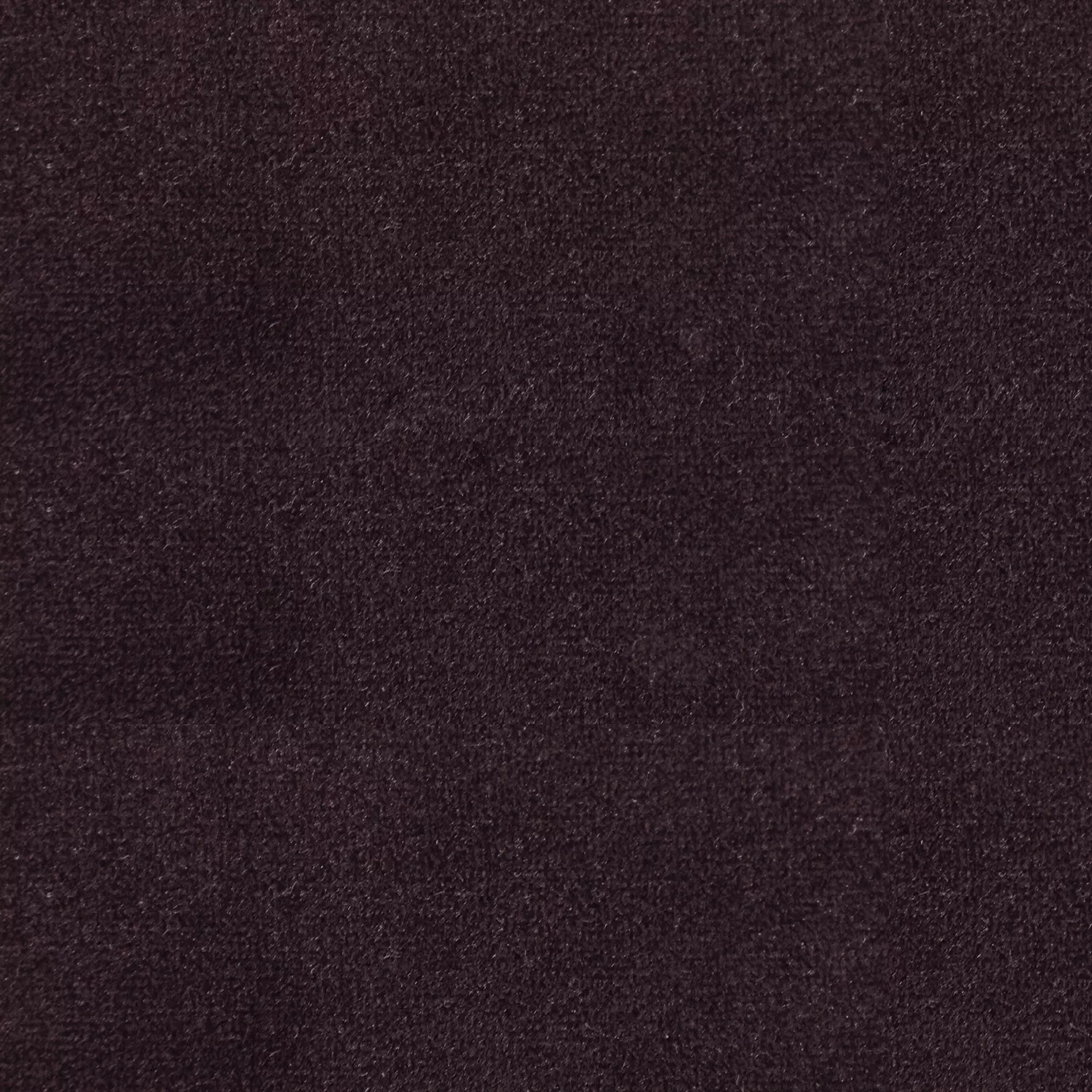 Soft and elegant close-up of a Lux Velvet Deep Bordeaux 0348 fabric swatch in a deep and sophisticated bordeaux tone, showcasing its velvety texture and a delicate sheen that gives it a feeling of comfort and intense elegance.