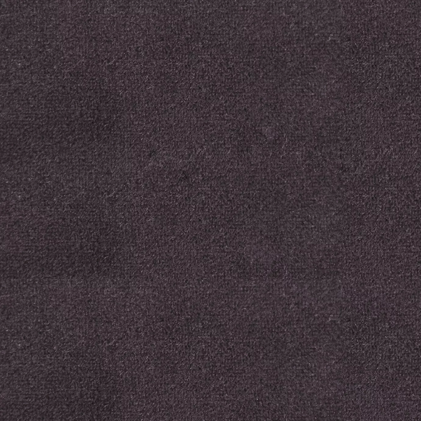 Soft and elegant close-up of a Lux Velvet Deep Mauve 0597 fabric swatch in a deep and sophisticated mauve tone, showcasing its velvety texture and a delicate sheen that gives it a feeling of comfort and intense elegance.