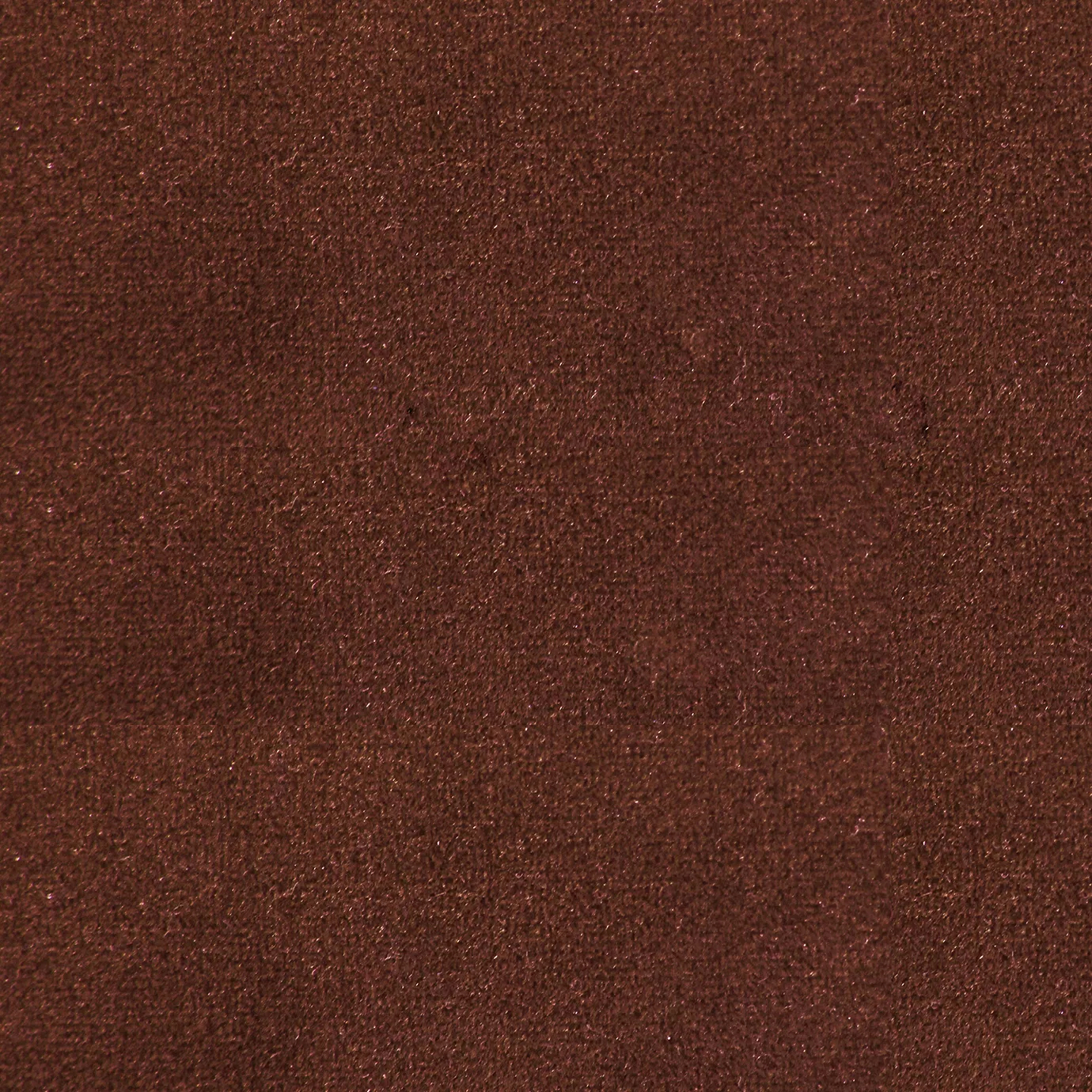 Soft and elegant close-up of a Lux Velvet Deep Ochre 0262 fabric swatch in a deep and warm ochre tone, showcasing its velvety texture and a delicate sheen that gives it a feeling of comfort and natural elegance.