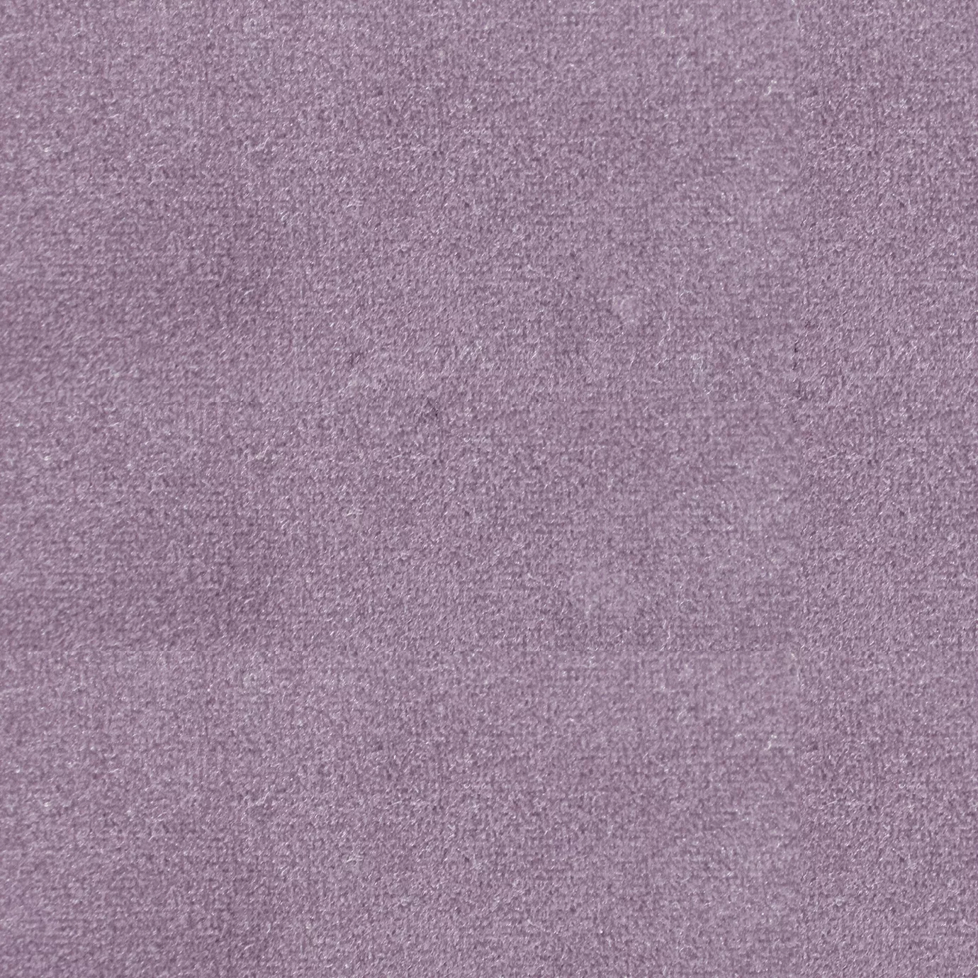 Soft and elegant close-up of a Lux Velvet Lavander 0547 fabric swatch in a soft and delicate lavender tone, showcasing its velvety texture and a delicate sheen that gives it a feeling of comfort and serene elegance.