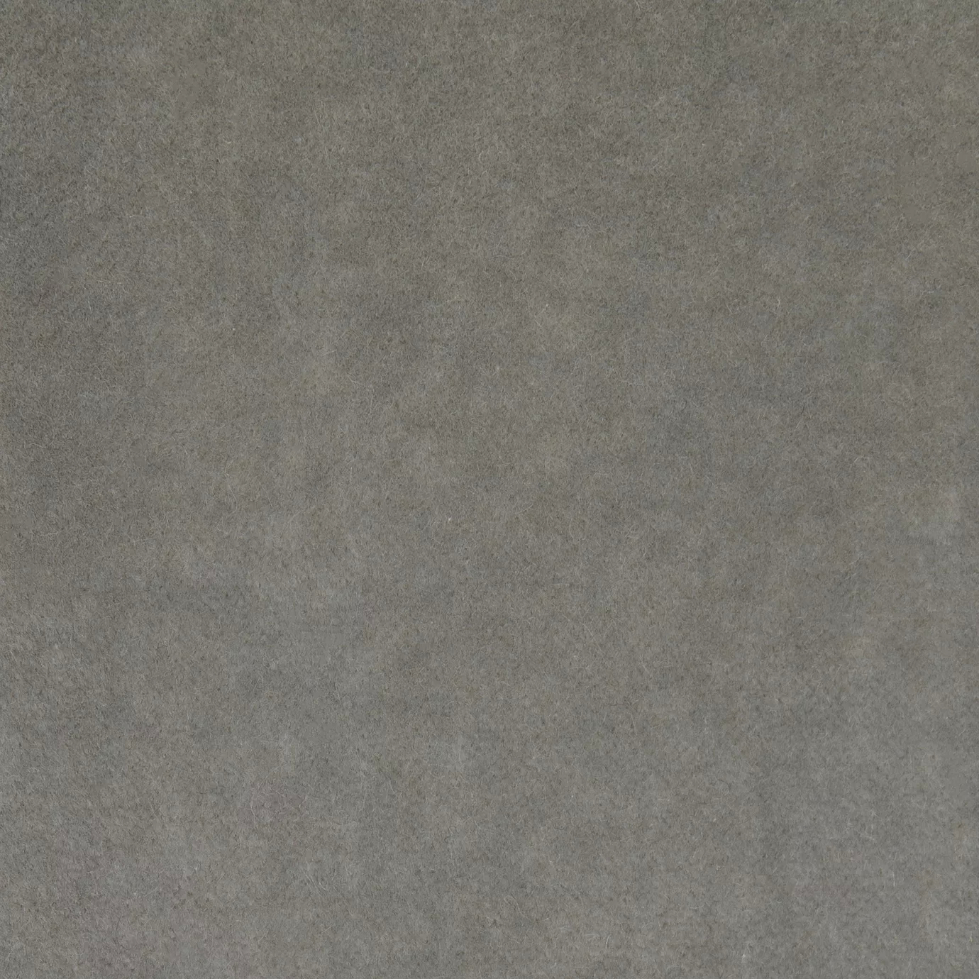 Soft and elegant close-up of a Lux Velvet Light Gray 1206 fabric swatch in a light and serene gray tone, showcasing its velvety texture and a delicate sheen that gives it a feeling of comfort and understated elegance.