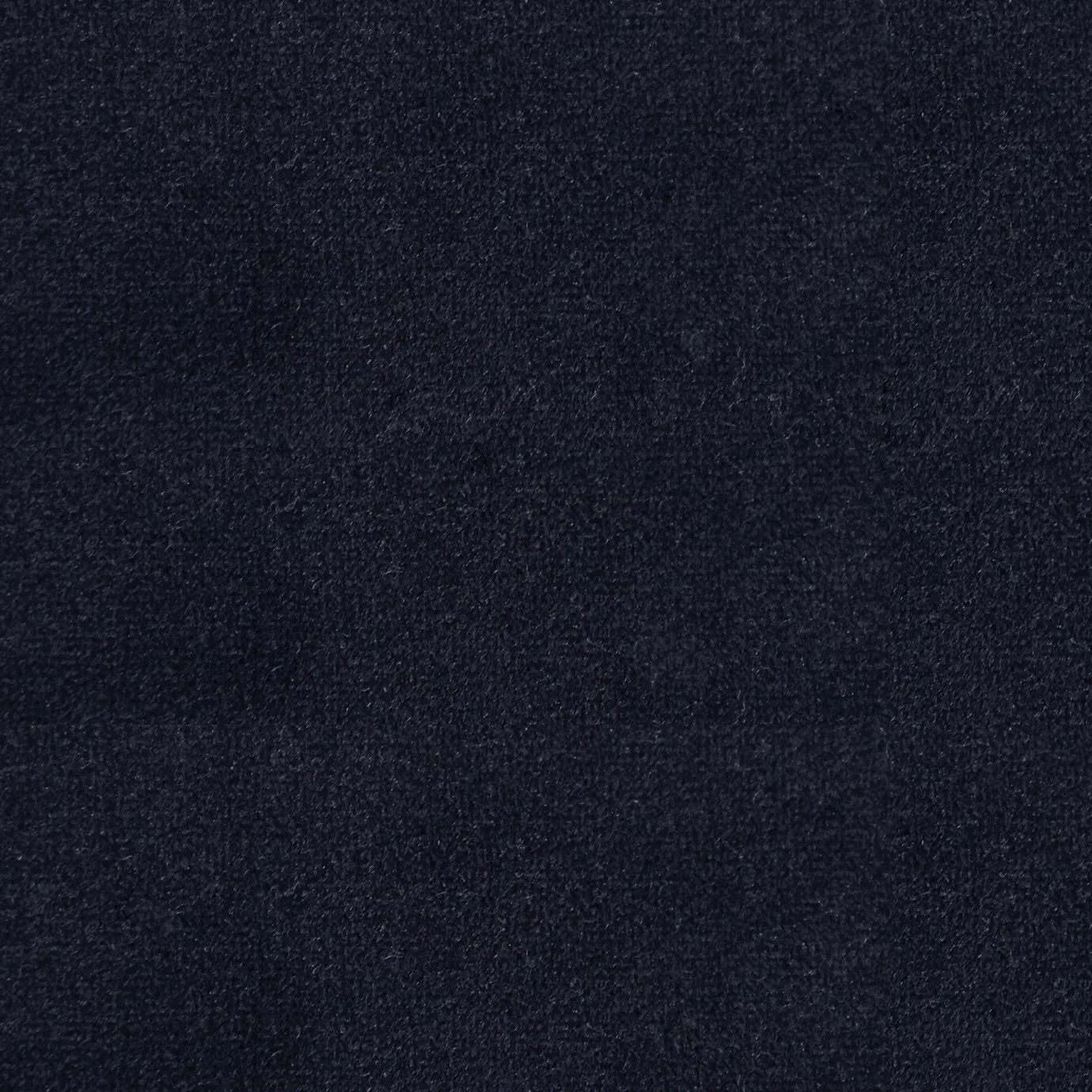 Soft and elegant close-up of a Lux Velvet Navy Blue 0642 fabric swatch in a deep and sophisticated navy blue tone, showcasing its velvety texture and a delicate sheen that gives it a feeling of comfort and intense elegance.
