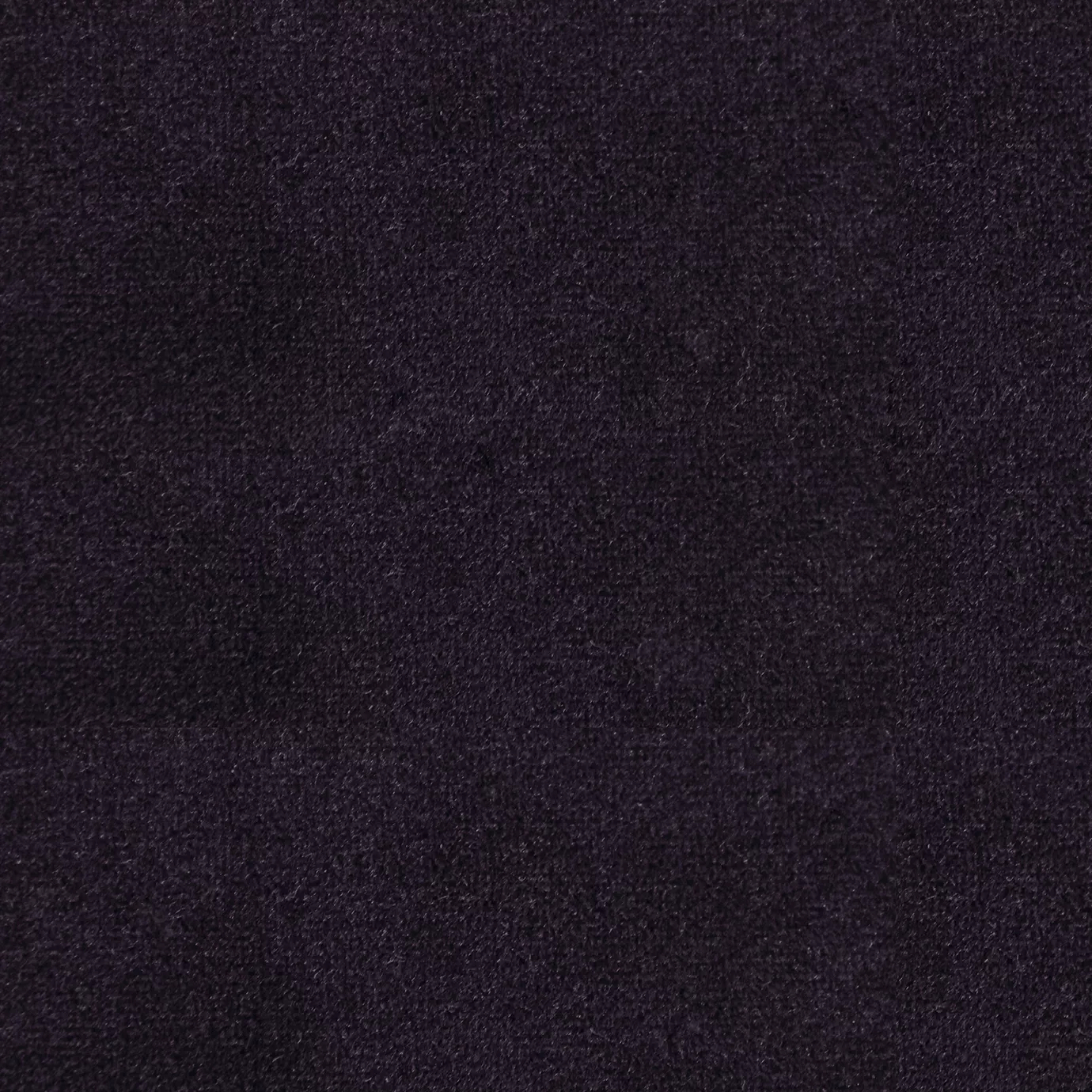 Soft and elegant close-up of a Lux Velvet Royal Purple 0374 fabric swatch in a deep and sophisticated royal purple tone, showcasing its velvety texture and a delicate sheen that gives it a feeling of comfort and intense elegance.