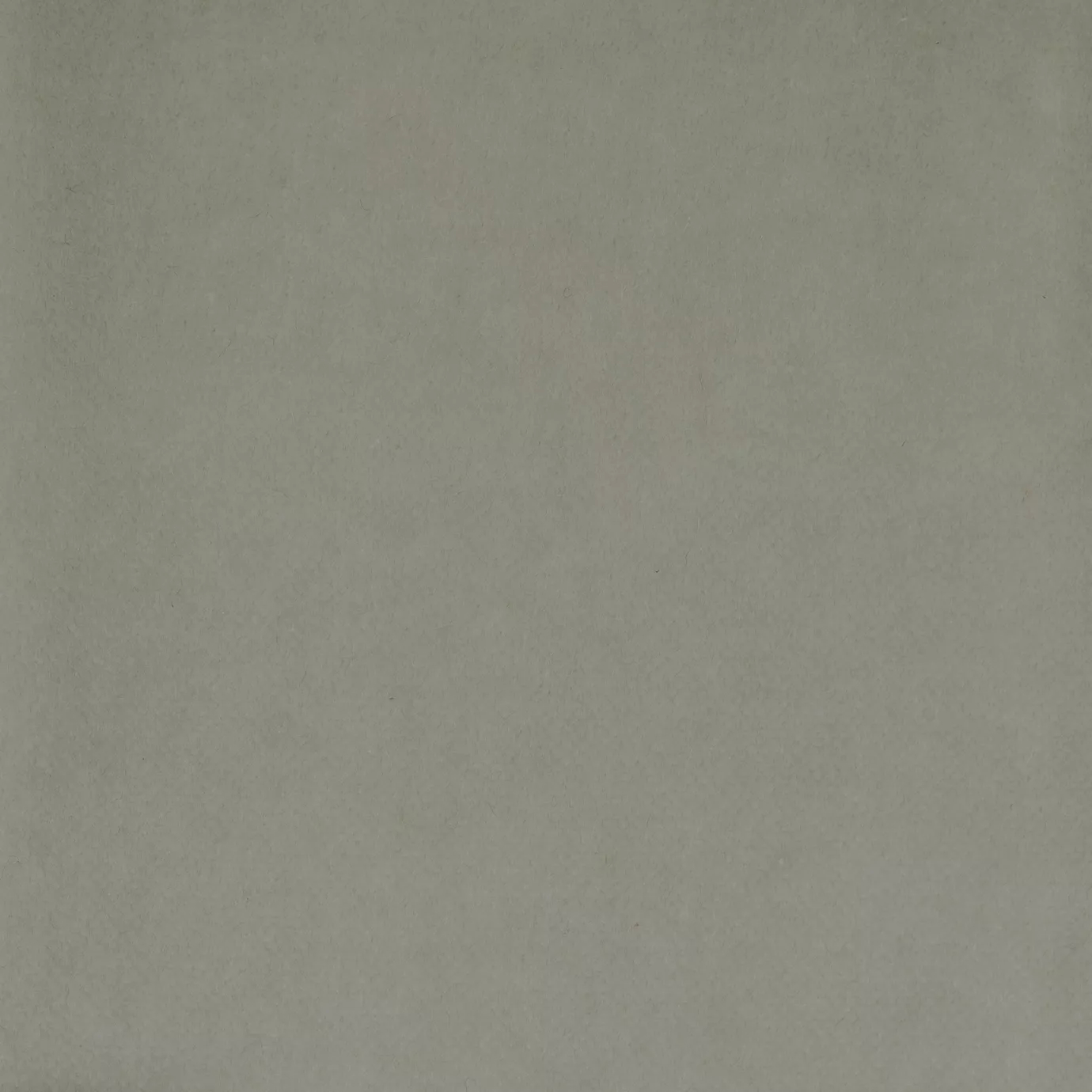 Soft and elegant close-up of a Lux Velvet Seafon 1200 fabric swatch in a soft and serene gray-white tone, showcasing its velvety texture and a delicate sheen that gives it a feeling of comfort and understated elegance.