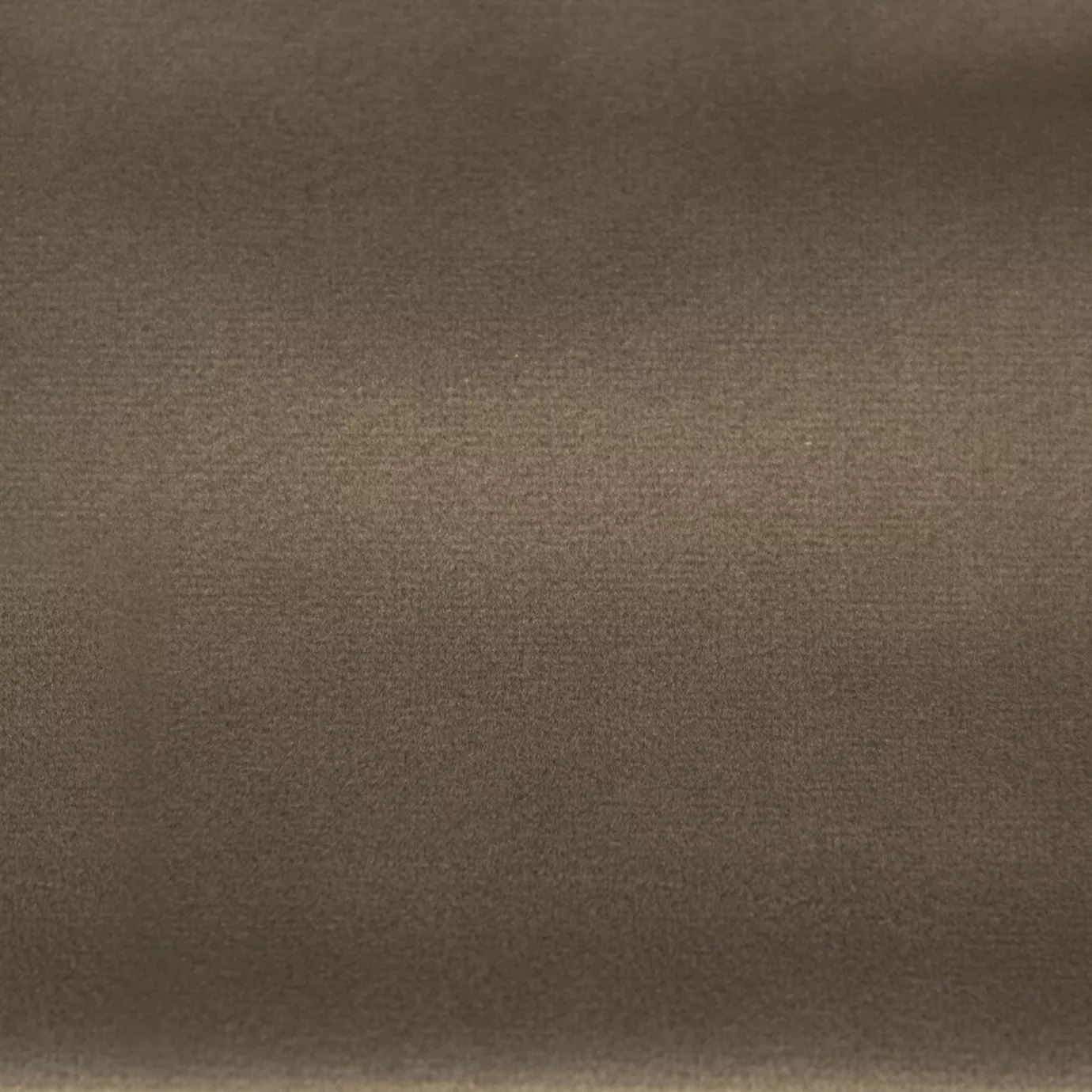 Soft and elegant close-up of a Lux Velvet Warm Taupe 0074 fabric swatch in a warm and welcoming taupe tone, showcasing its velvety texture and a delicate sheen that gives it a feeling of comfort and natural elegance.