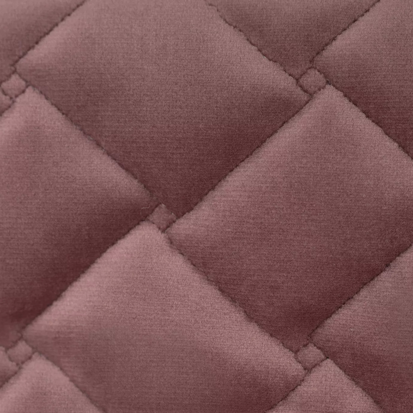 Elegant close-up of the Cloud Velvet Ash Rose fabric with a soft texture and diamond-quilted pattern in ash rose color.
