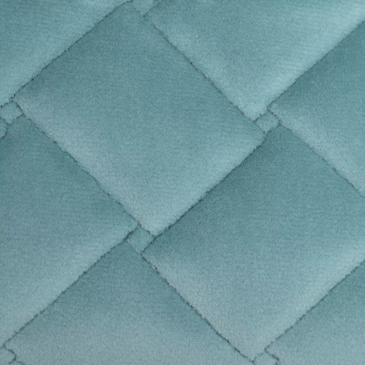 Elegant close-up of a Cloud Velvet Capri Blue fabric swatch in a vibrant and soft Capri blue tone, featuring a diamond-quilted pattern that gives it a fluffy texture and a soft touch, conveying a feeling of lightness and fresh elegance.