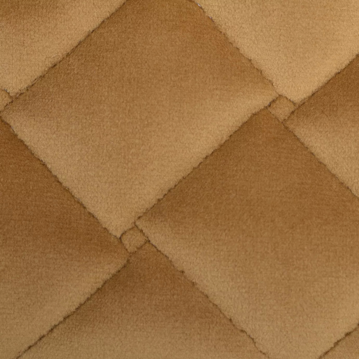 Close-up of a Cloud Velvet Curry fabric swatch in a warm and soft curry tone, featuring a diamond-quilted pattern that gives it a dimensional texture and a soft touch, evoking a feeling of comfort and cozy elegance.