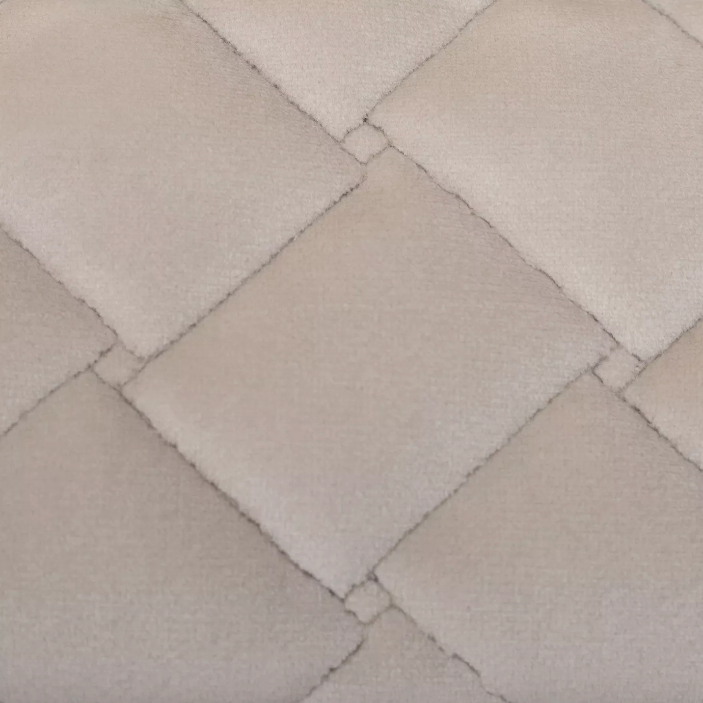 Elegant close-up of the Cloud Velvet Sand fabric with a soft texture and diamond-quilted pattern in sand color.