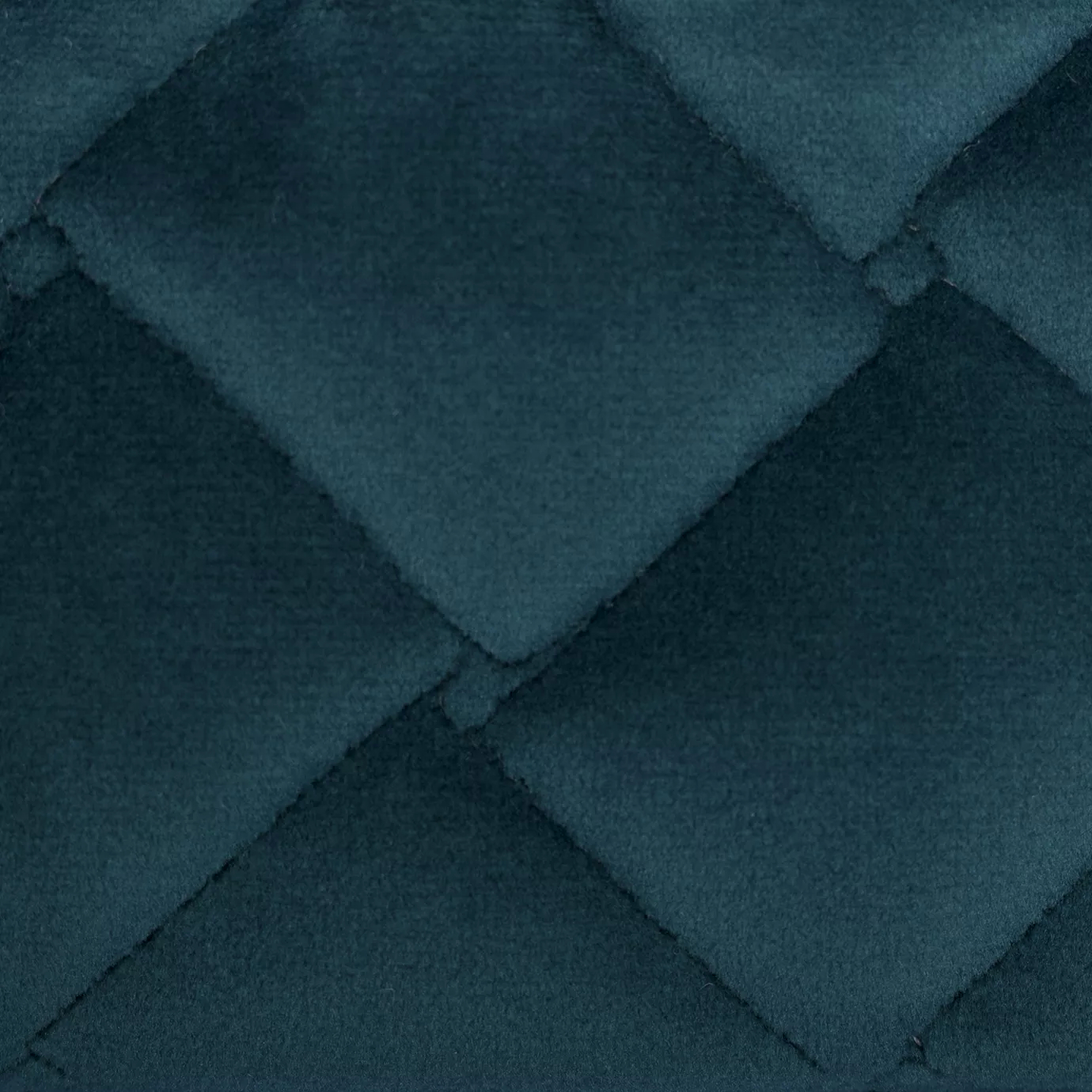 Elegant close-up of the Cloud Velvet Storm Blue fabric with a soft texture and diamond-quilted pattern in storm blue color.