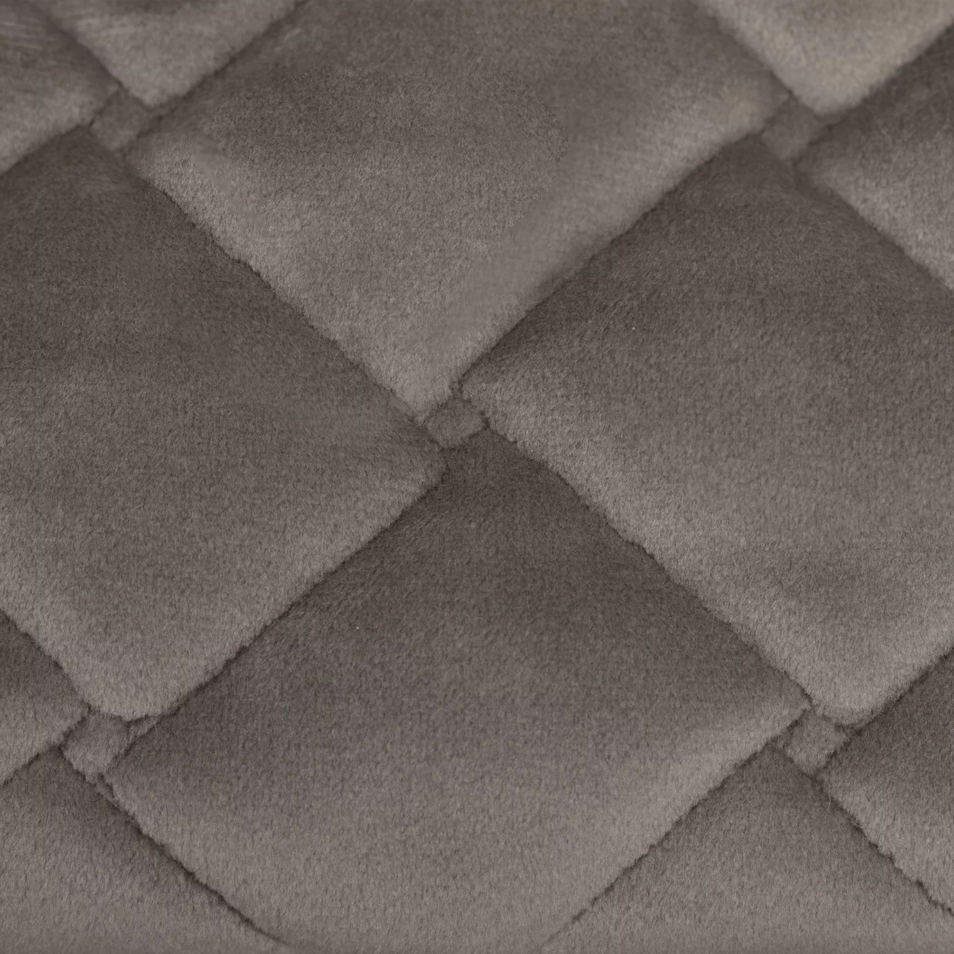 Close-up of a Cloud Velvet Taupe fabric swatch in an elegant and soft taupe tone, featuring a diamond-quilted pattern that gives it a dimensional texture and a soft touch, evoking a feeling of comfort and sophisticated elegance.