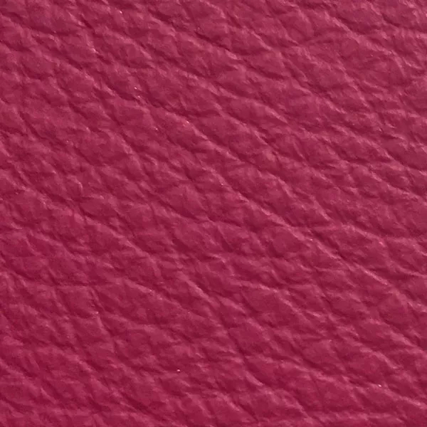 Close-up of a Harbor Cactus Flower fabric swatch in a vibrant fuchsia pink tone with texture, showcasing its raised areas and grooves that give it a natural and elegant feel. The soft sheen highlights the depth of its texture.