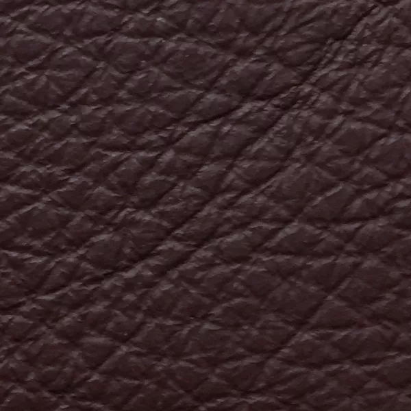 Close-up of a Harbor Cordovan fabric swatch in a deep reddish-brown tone with texture, showcasing its raised areas and grooves that give it a natural and elegant feel. The soft sheen highlights the depth of its texture.