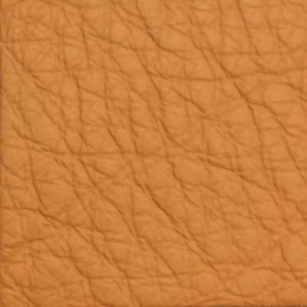 Close-up of a Harbor Hazel fabric swatch in a warm hazel tone with texture, showcasing its raised areas and grooves that give it a natural and elegant feel. The soft sheen highlights the depth of its texture.