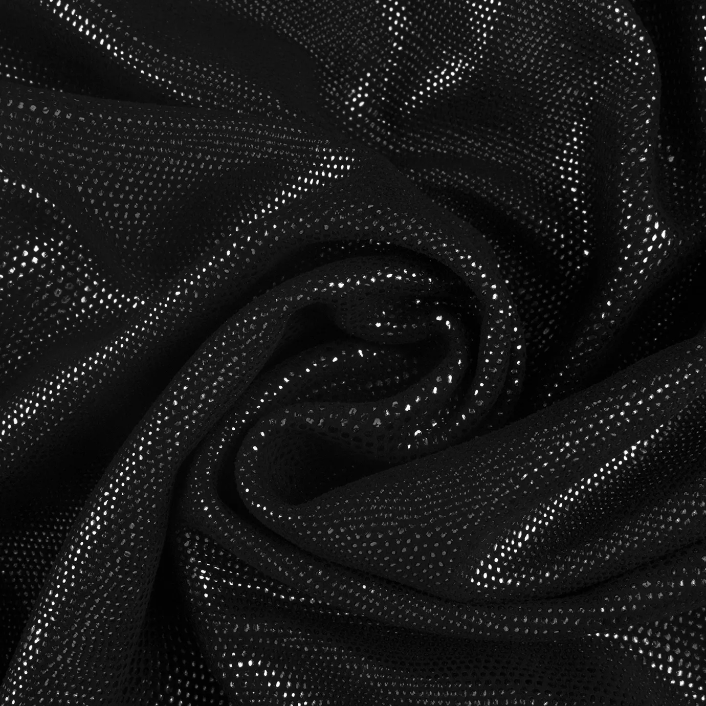 Close-up Pixel Silver Leather: textured black fabric with small, shiny silver dots. Features spiraling folds and dynamic light reflections.