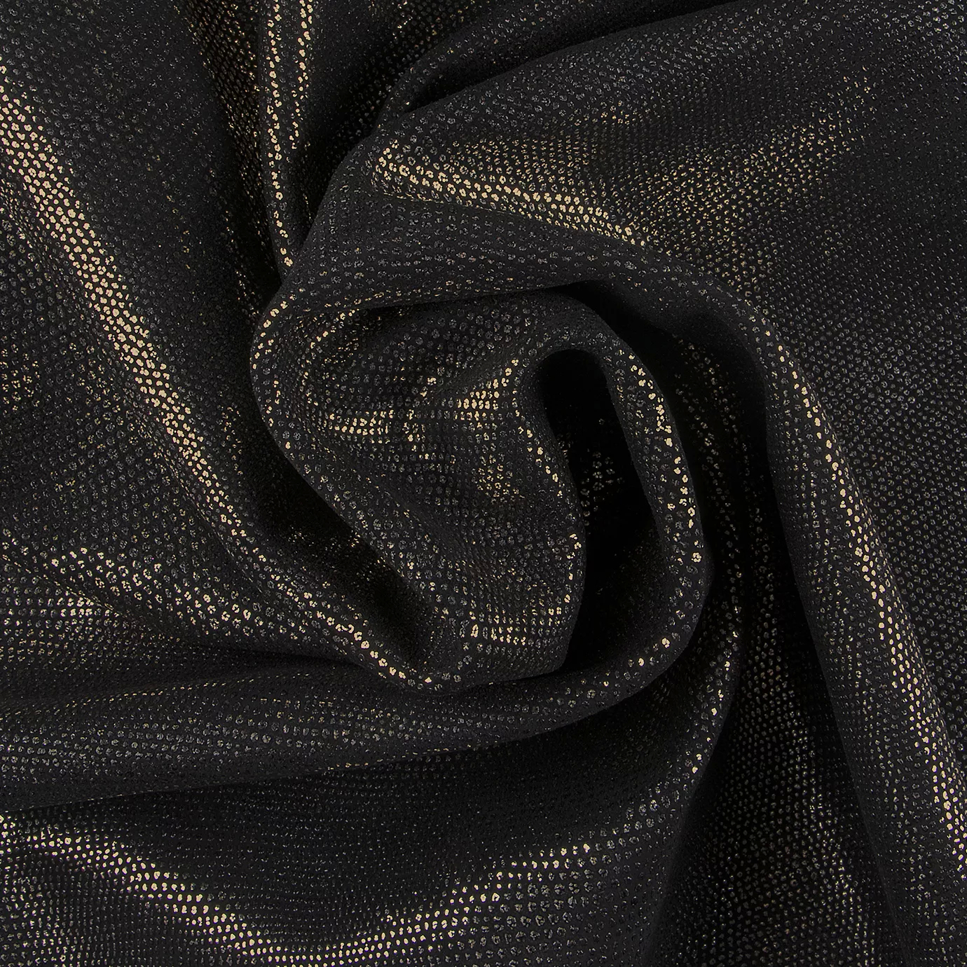 Close-up Pixel Gold Leather: textured black fabric with small, shiny golden dots. Features pronounced folds and intense light reflections.