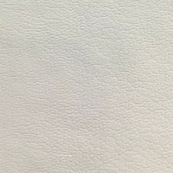 Close-up Jet 70 Synthetic Leather: white synthetic leather with a fine pebbled texture. Features a smooth and even sheen.