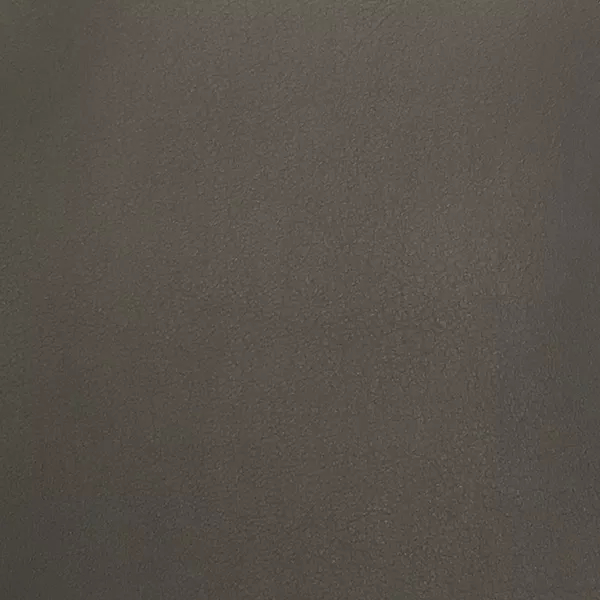 A close-up of Komodo 12402 Synthetic Leather shows a fine, slightly raised texture with subtle variations in a dark, medium gray.