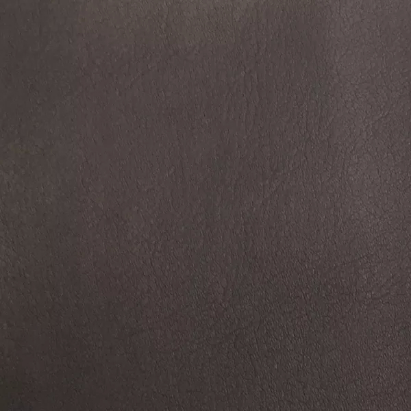 A close-up of Komodo 12406 Synthetic Leather shows a fine, slightly raised texture with subtle variations in a rich, dark brown.