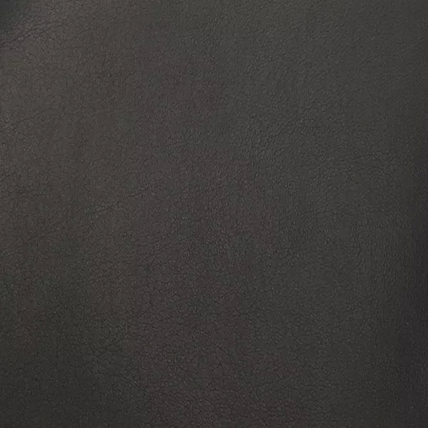 A close-up of Komodo 12422 Synthetic Leather shows a fine, slightly raised texture with subtle variations in a deep charcoal gray.