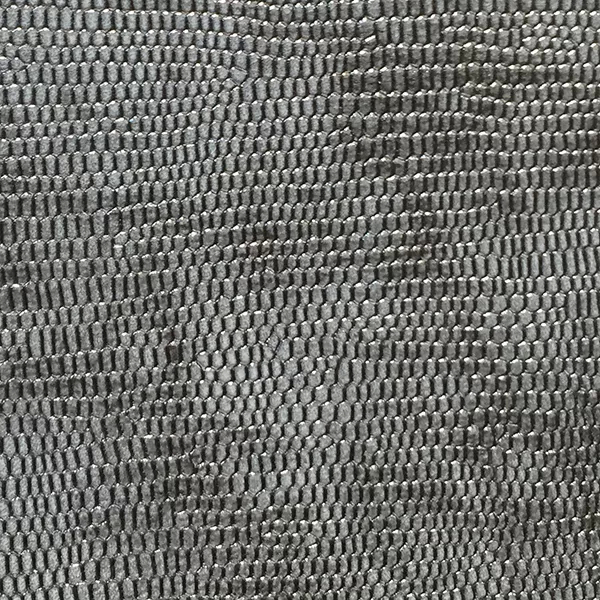 A detailed close-up of Ofidia Pewter Synthetic Leather shows a textured, repeating pattern resembling reptile scales in a dark, metallic gray tone.