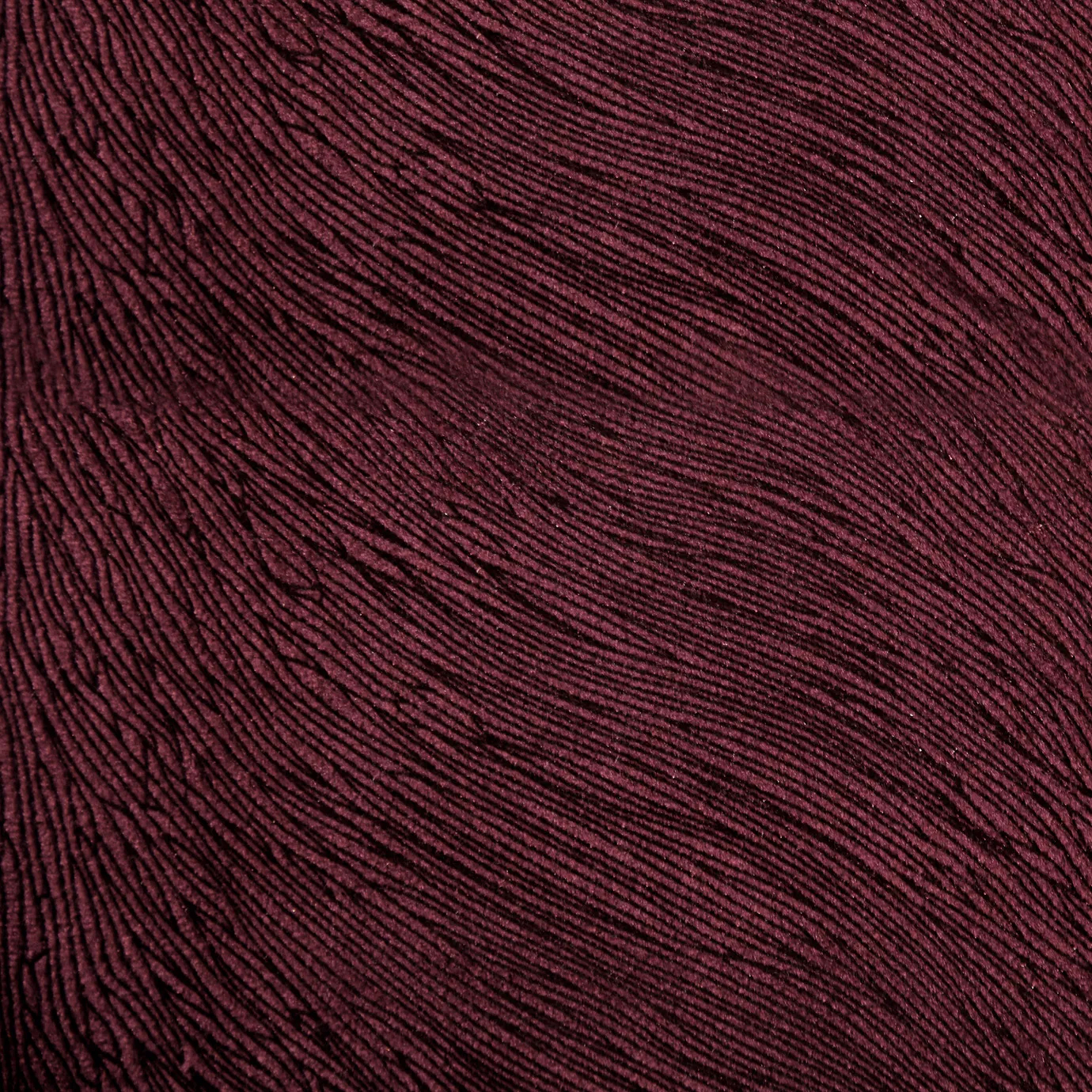 A detailed view of textured Hide Velvet 011 fabric in a deep burgundy or wine color.
