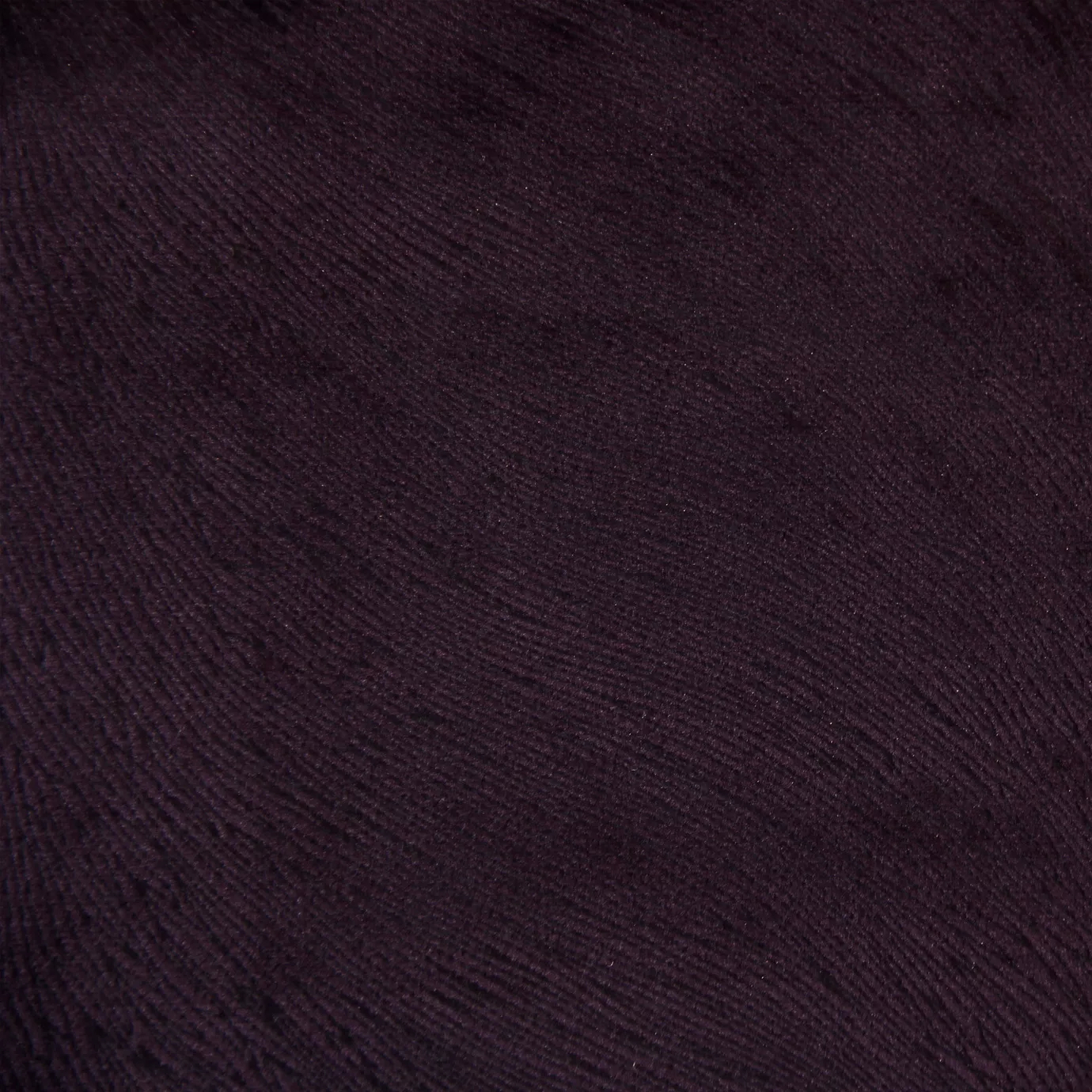 Hide Velvet 083 Fabric with a deep, rich purple hue and subtle texture, showcasing its luxurious and versatile appearance.