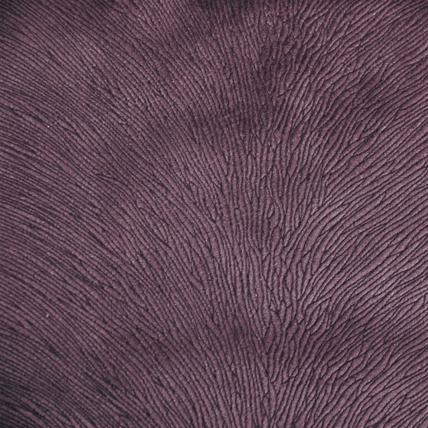 A close-up shot of textured Hide Velvet 085 fabric in a rich, deep purple or plum color.