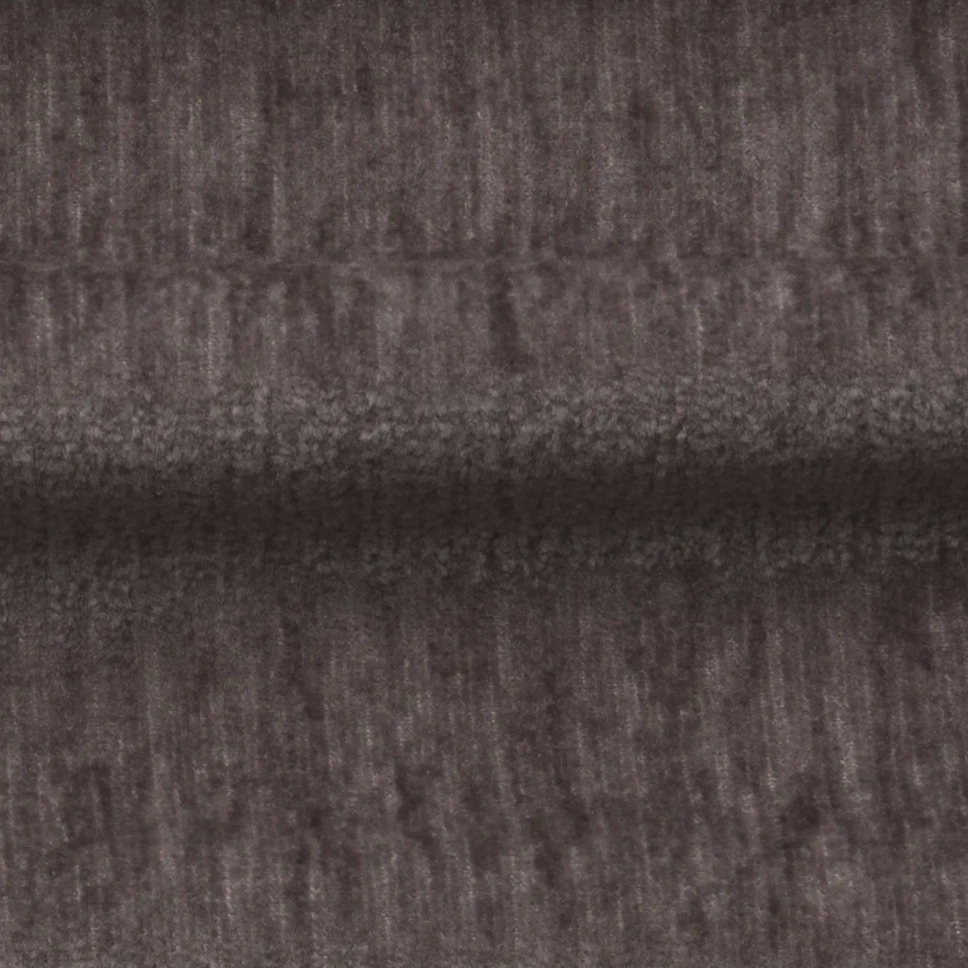 Soft, textured Mauve Belle Velvet fabric with subtle variations in its dusty, purple-gray tones, creating a plush and inviting surface.