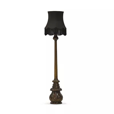 Floor lamp with black fabric lampshade and iridescent green base.