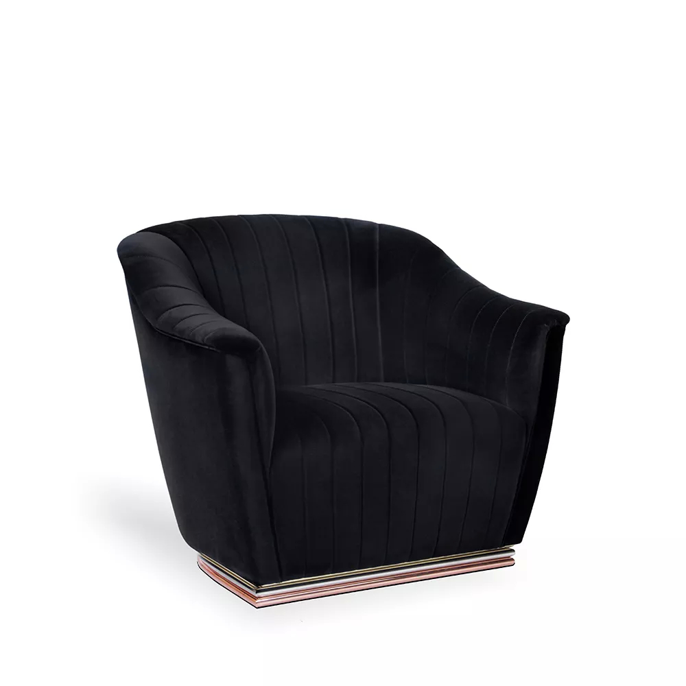 Armchair, with smooth and curved lines, fully upholstered with smooth black fabric, and base that combines three colors of metals, silver, gold and copper.
