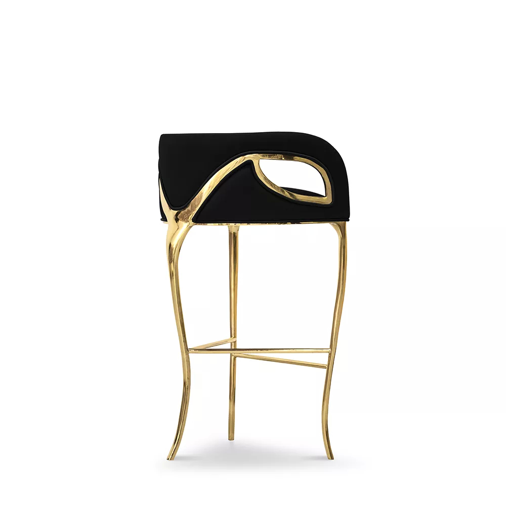 Bar stool upholstered in black with golden finish in the rear side view.