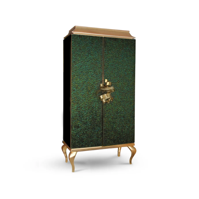 Covered in delicate dark green peacock feathers, Divine Peacock Feather Armoire has a golden frame and is adorned with a golden handle resembling a ribbon.