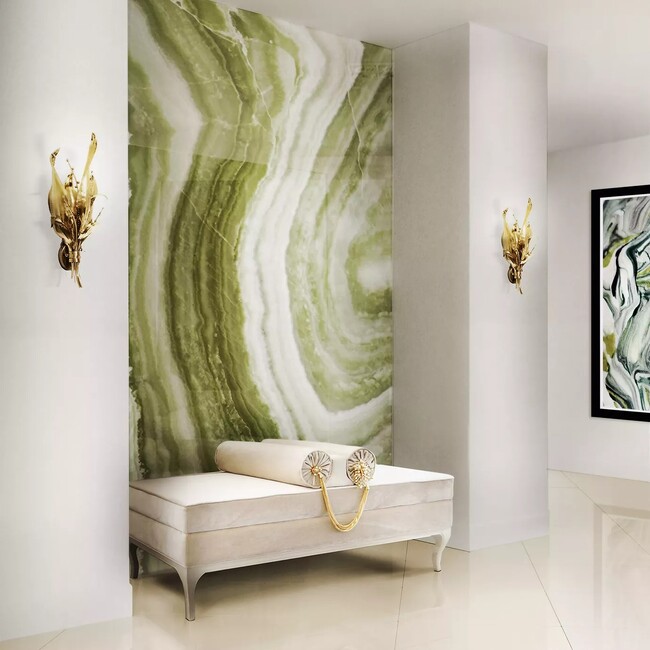 Botanica Sconce by KOKET with aged brass finish, a nature-inspired brass light fixture for sophisticated wall lighting.