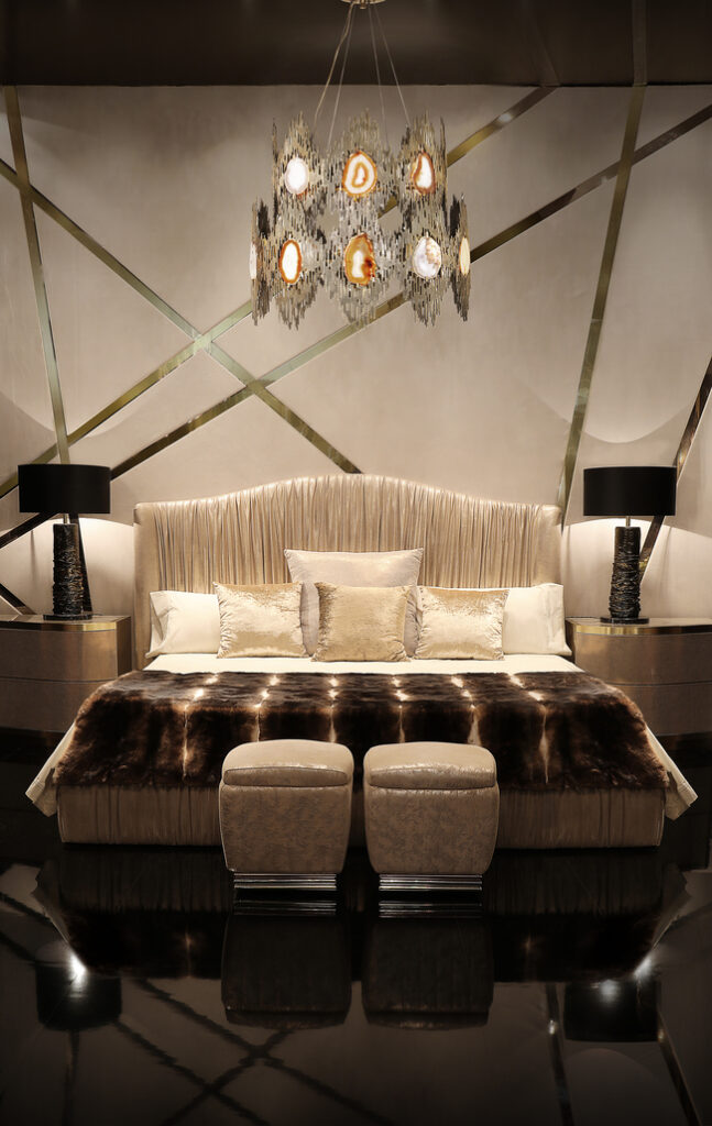 Fully upholstered bed with puckered fabric and vintage character.