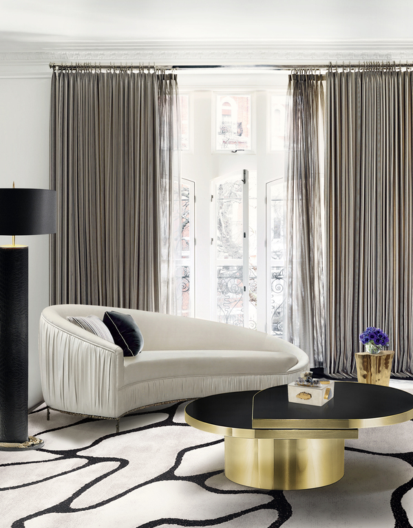 Mid-century modern sofa with metal base and plush curves by KOKET.