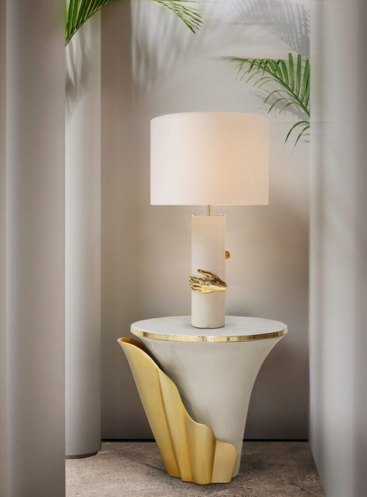 Modern side table with mother of pearl finish and elegant silhouette by KOKET