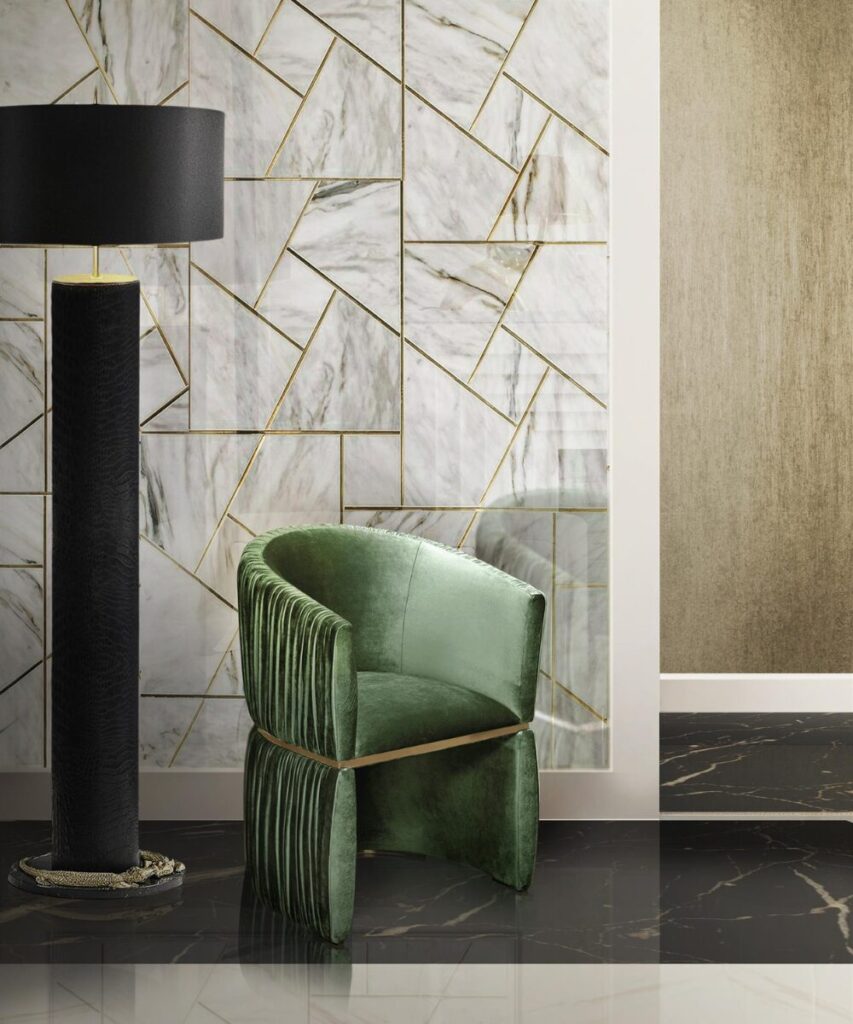 Bold jewel-toned living room with Cuff Chair and dramatic lighting, ideal for luxury interiors.