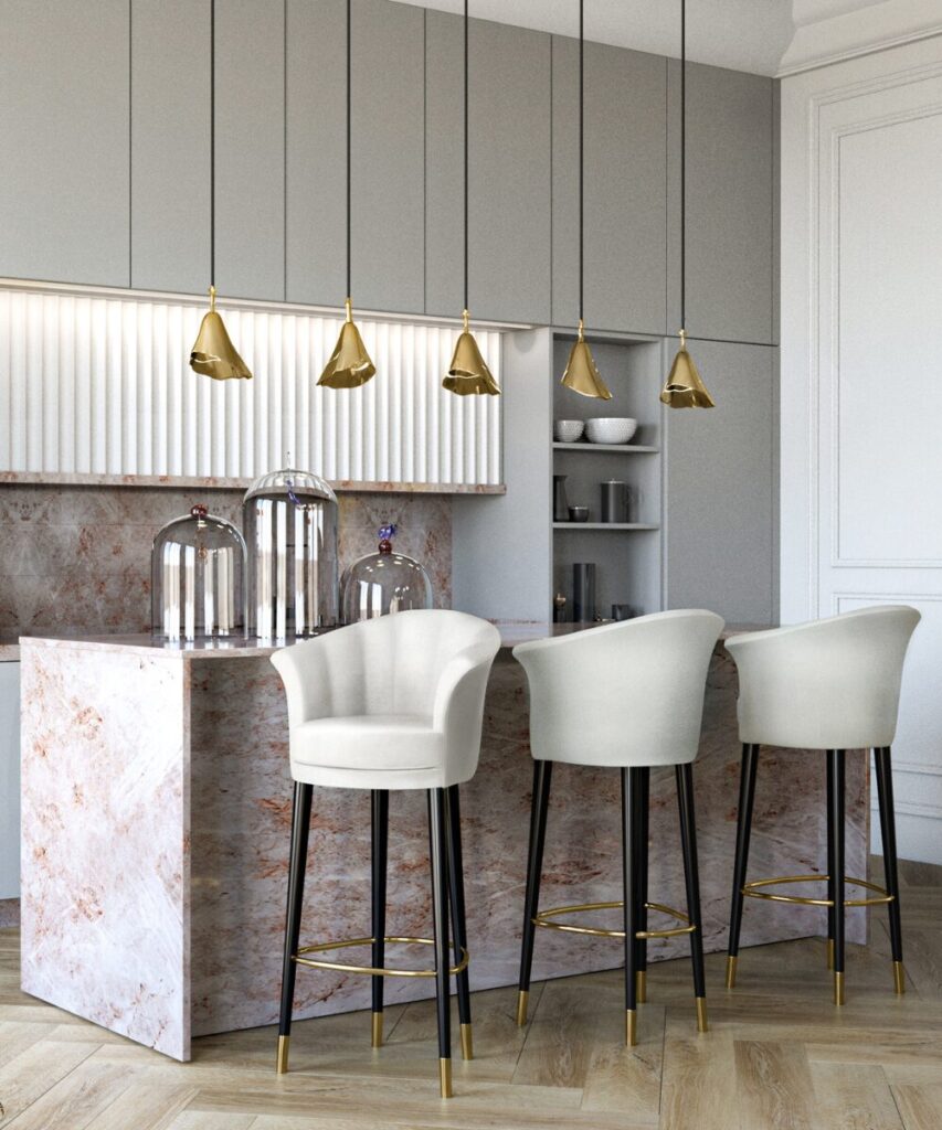 Gia Pendant lighting fixture adding golden glow to brass kitchen design.