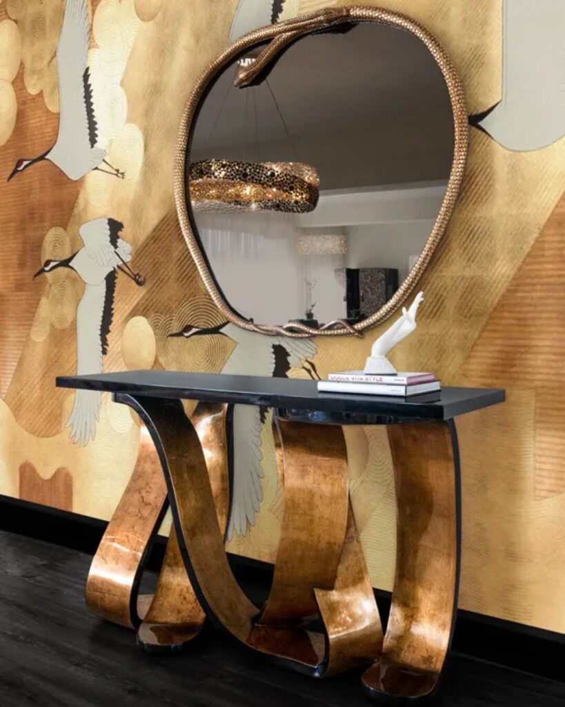 Ribbon luxury entryway table by KOKET with broken gold leaf finish