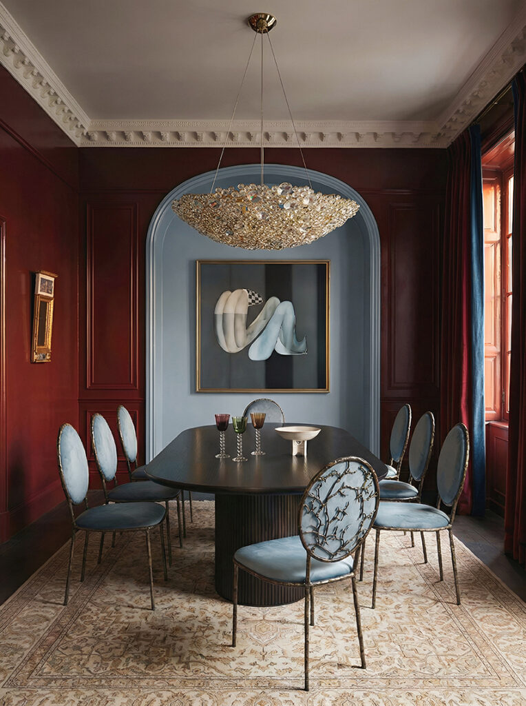 Cinematic dining room with round table and sculptural chairs