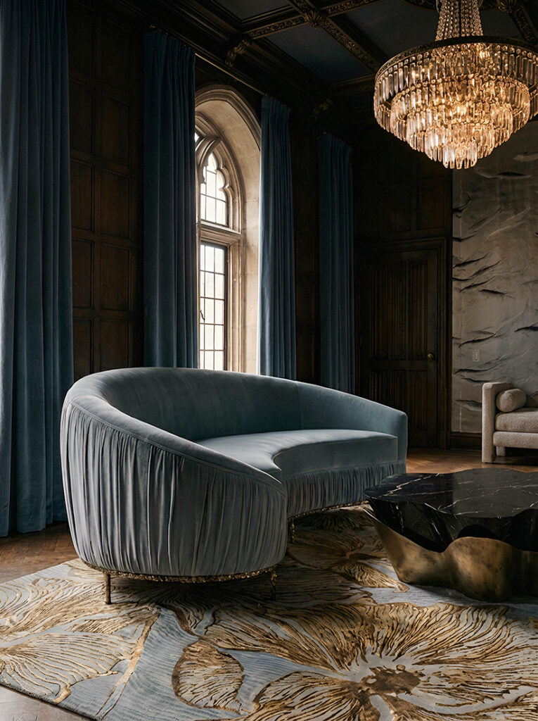 Cinematic living room with sculptural sofa by KOKET