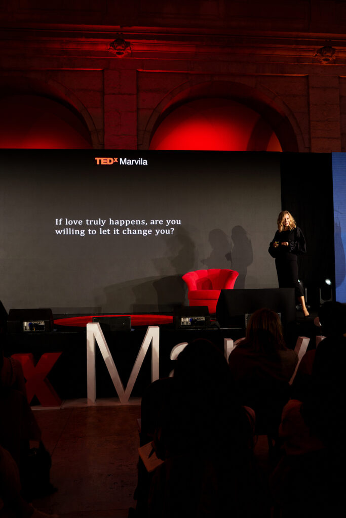 Janet Morais speaking on stage at Tedx Marvila 2026 in Lisbon Portugal on What's Is Love? - Telling The Greatest Love Story - Love Happens
