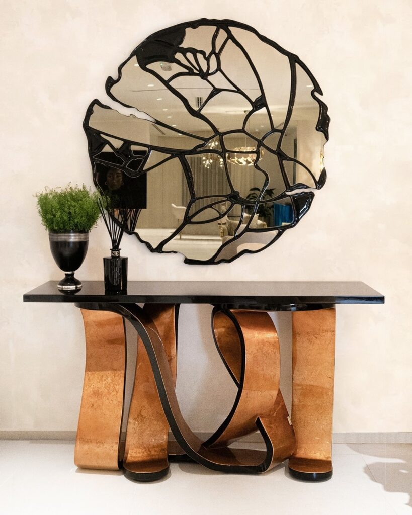 ribbon console table by KOKET in the Da Terra showroom in Dubai - gold and black console hallway entry table