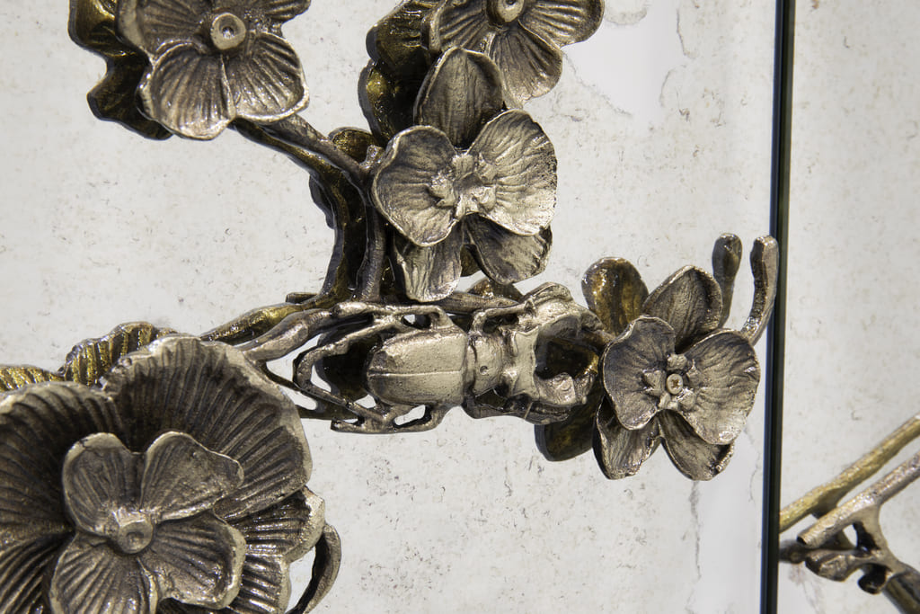 aged mirror and cast brass floral furniture