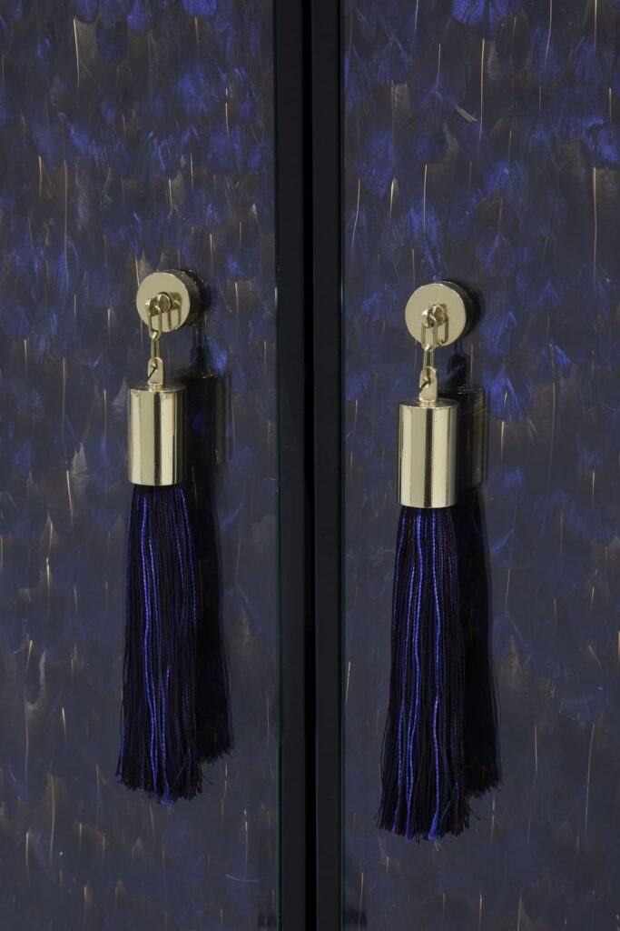 temptation cabinet with purple feather doors by koket